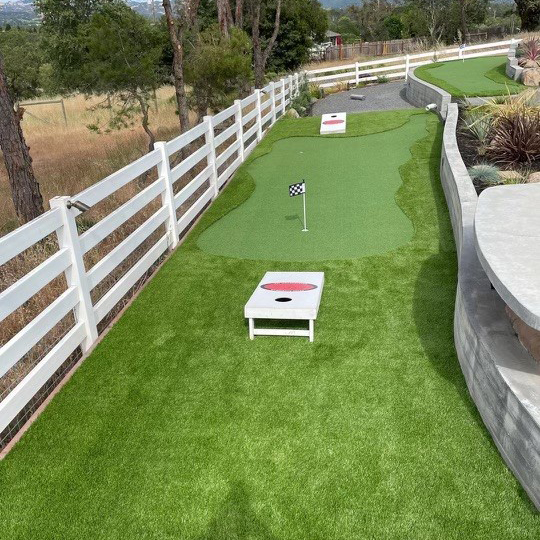 Putting field and corn hole with Performance Putt and Evernatural Classic