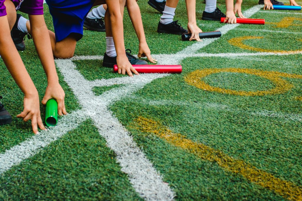 Artificial sports turf is great for kids on a soccer field, putting field, or running track.
